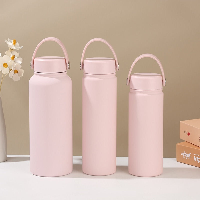 Women's double-walled insulated water bottle with practical carrying handle Bowlift