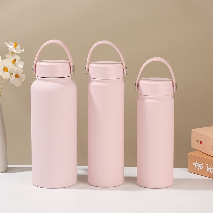 Women's double-walled insulated water bottle with practical carrying handle Bowlift