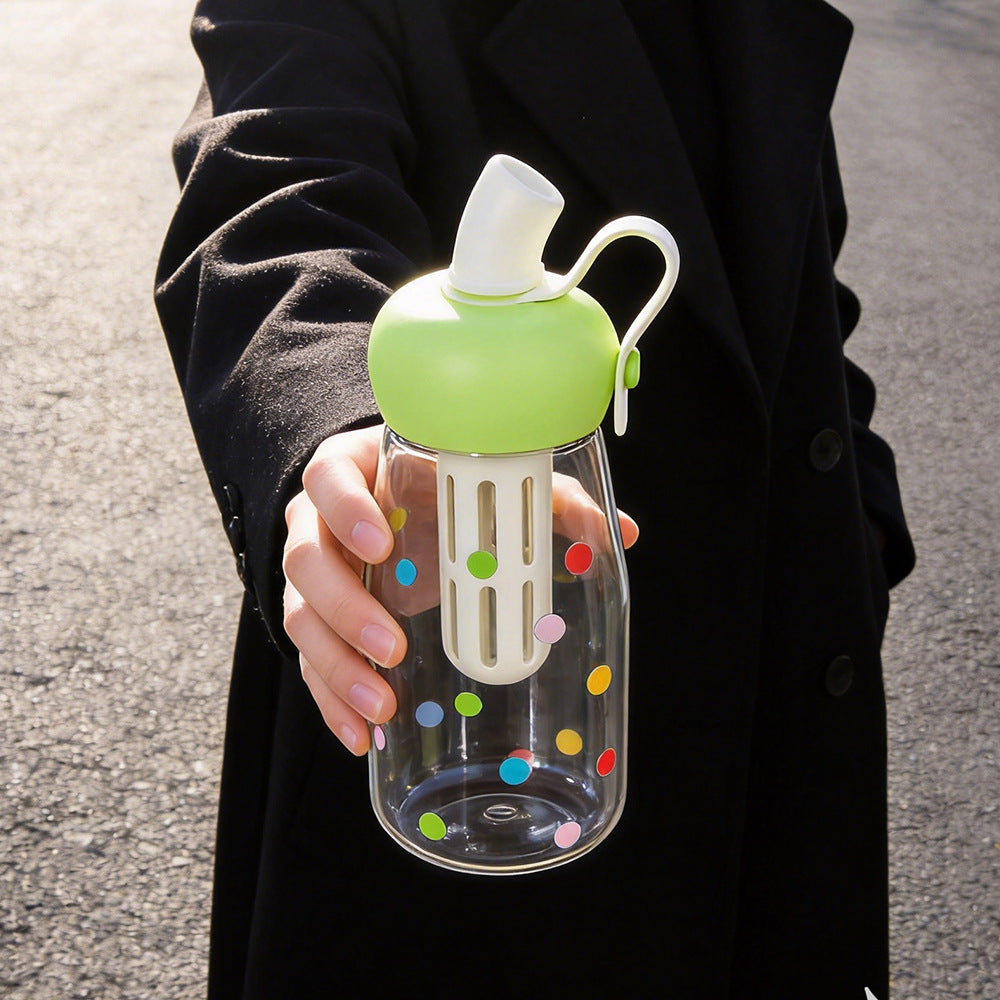Women's water bottle with integrated fruit filter and practical carrying handle Bowlift