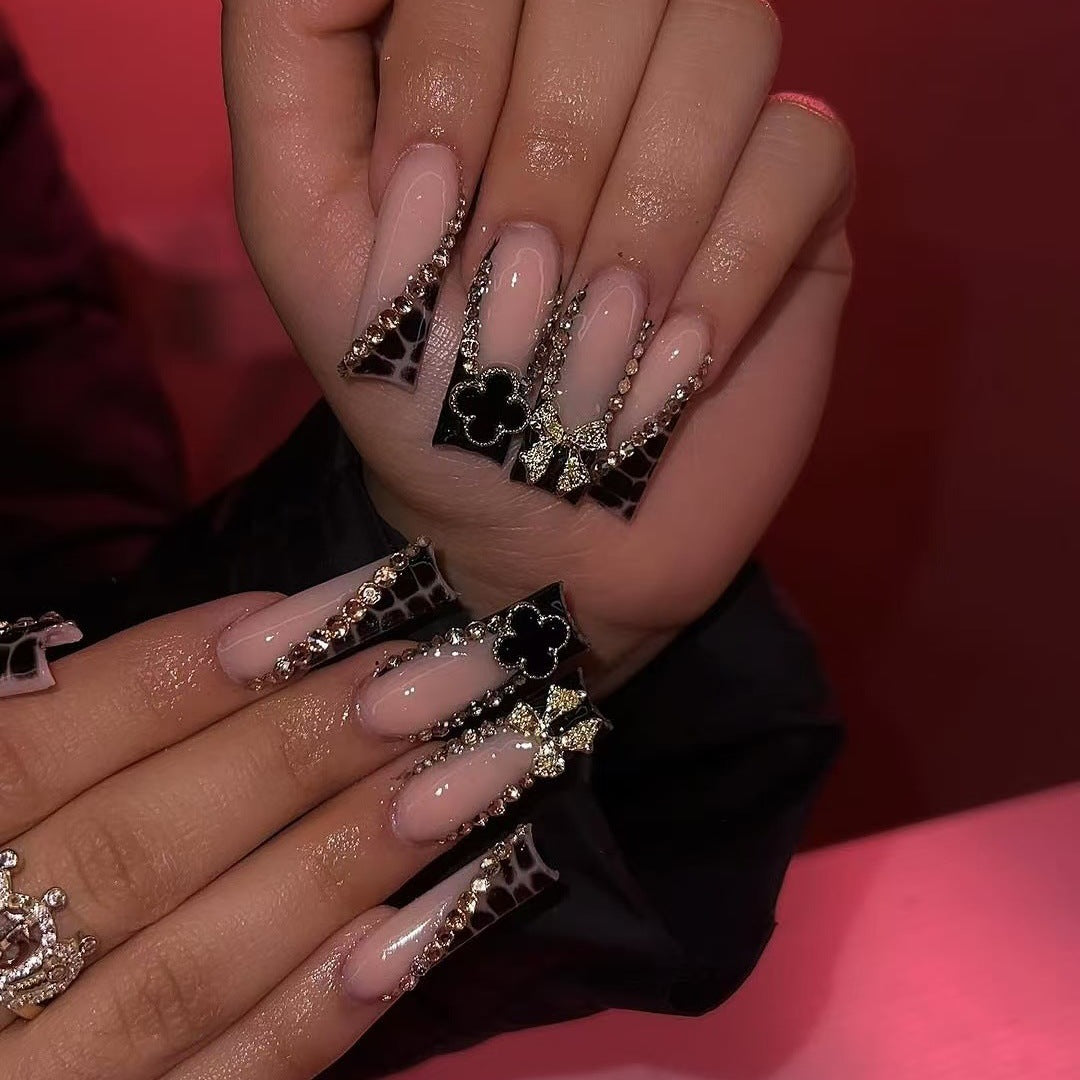 Glamorous artificial nails with elegant design with rhinestones and 3D decorations Bowlift