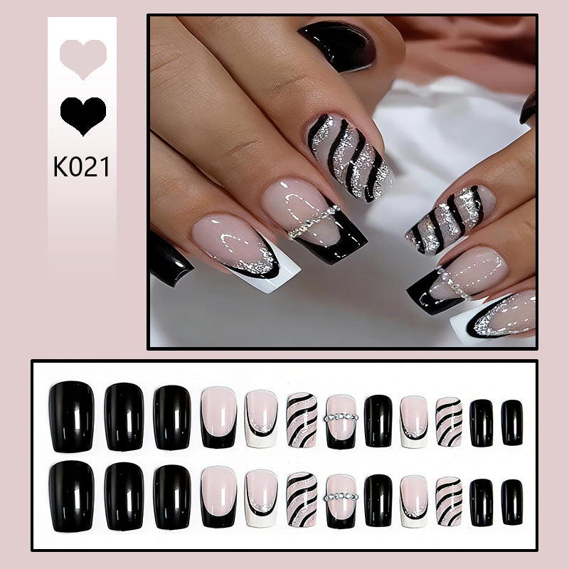 Elegant artificial nails with glitter and stripe accents Bowlift