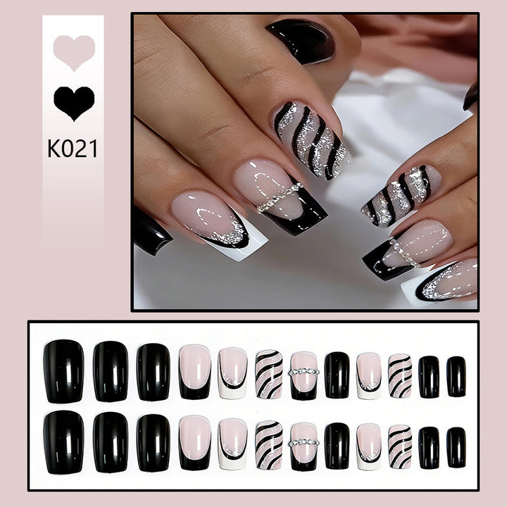 Elegant artificial nails with glitter and stripe accents Bowlift