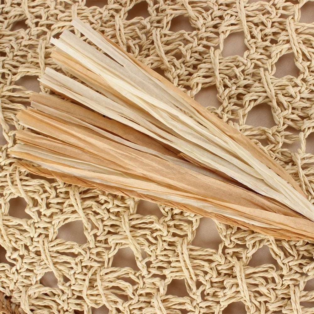 Handbag Made of Hand-Woven Natural Material with Appealing Tassel Detail Bowlift