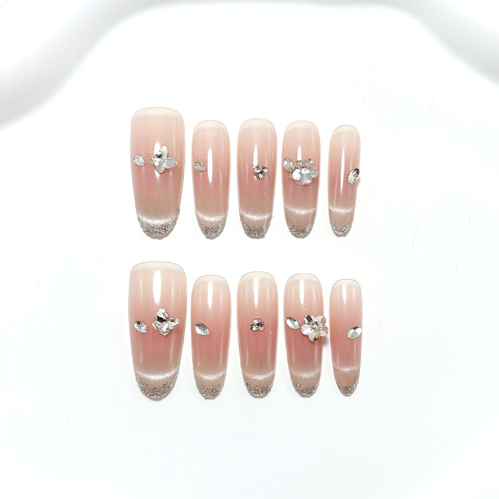 Glamorous artificial nails with rhinestone decorations Bowlift