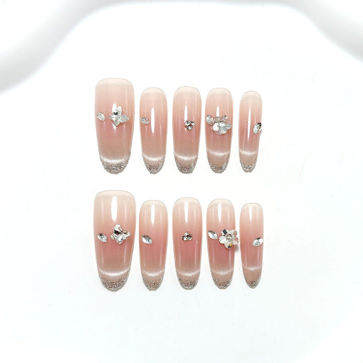 Glamorous artificial nails with rhinestone decorations Bowlift