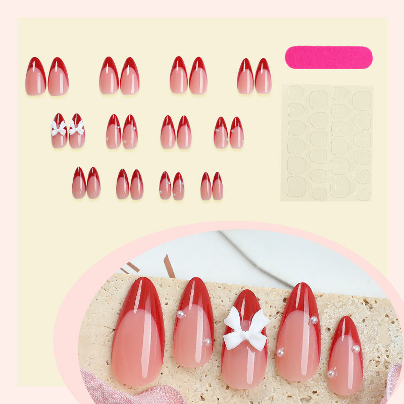 Artificial nail set with elegant bows and glitter accents Bowlift