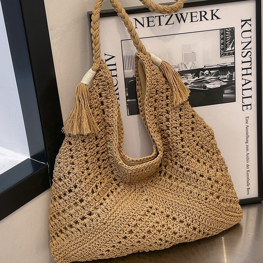 Hand-knotted shoulder bag with tassels and spacious interior Bowlift