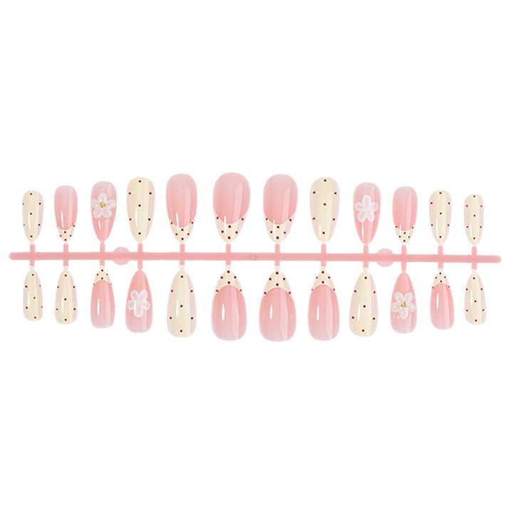 Creative nail art set with floral accents and glitter Bowlift
