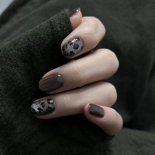 Artistic Press-On Nail Design with Glossy and Textured Patterns Bowlift
