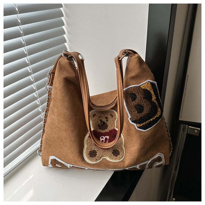 Shoulder bag in playful bear pattern Bowlift