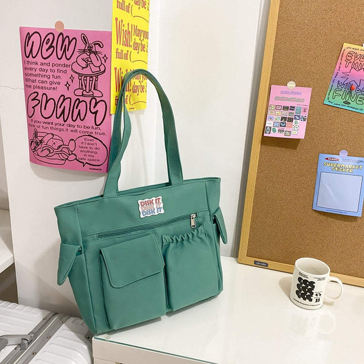 Tote bag with versatile compartments and ergonomic design Bowlift