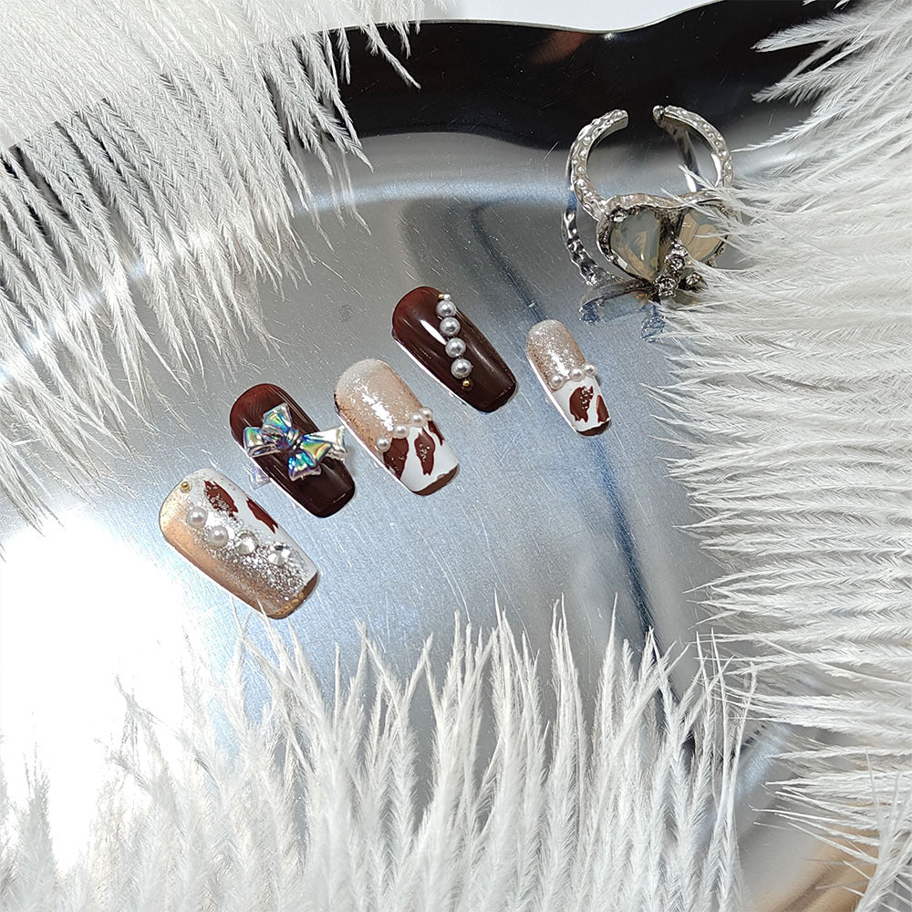 Artificial nails with glamorous rhinestone and bow design Bowlift