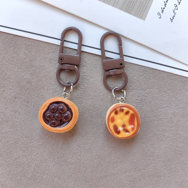 Keychain with cute cake design Bowlift
