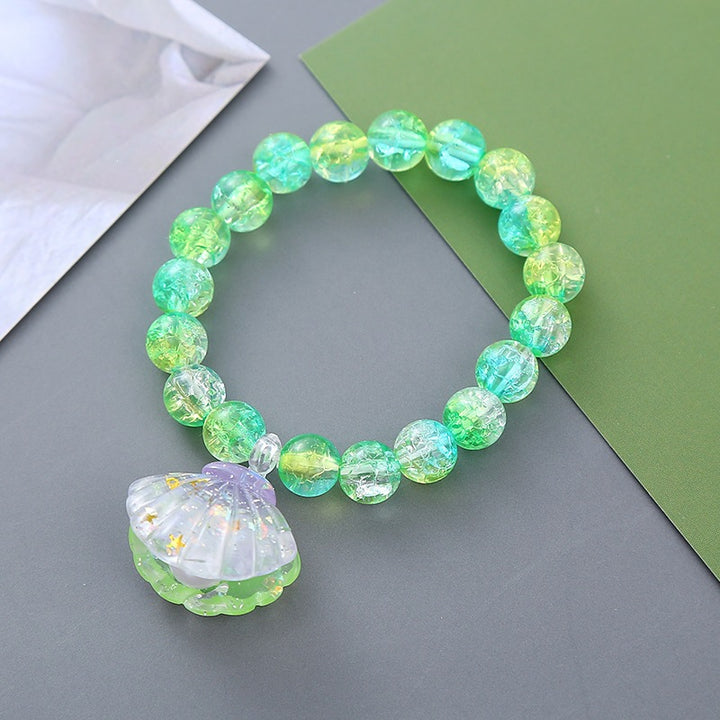 Playful bracelet with shell pendant Bowlift