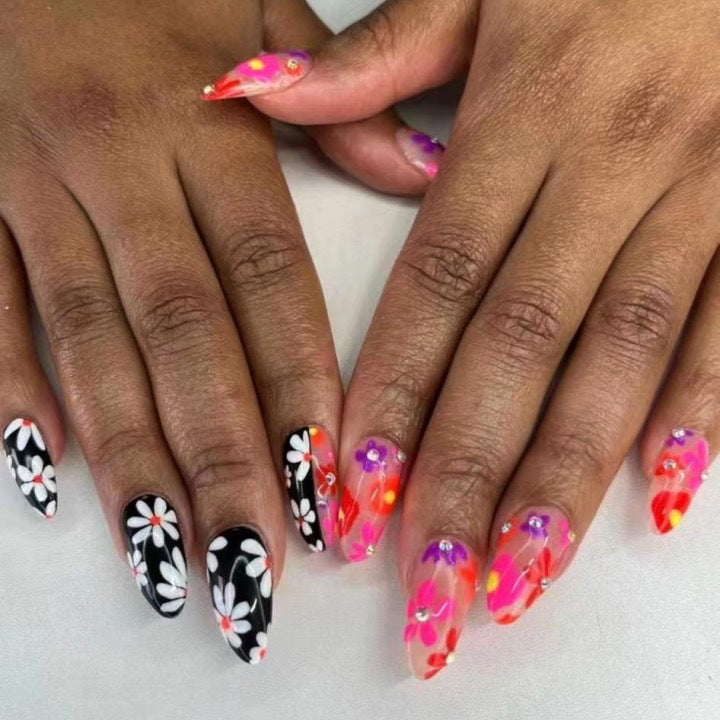 Artificial nail set with floral 3D embellishments and glitter accents Bowlift