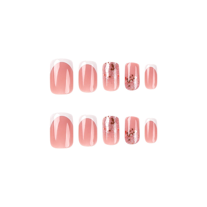 Artful Nail Art with Elegant Glitter and French Tip Accents Bowlift