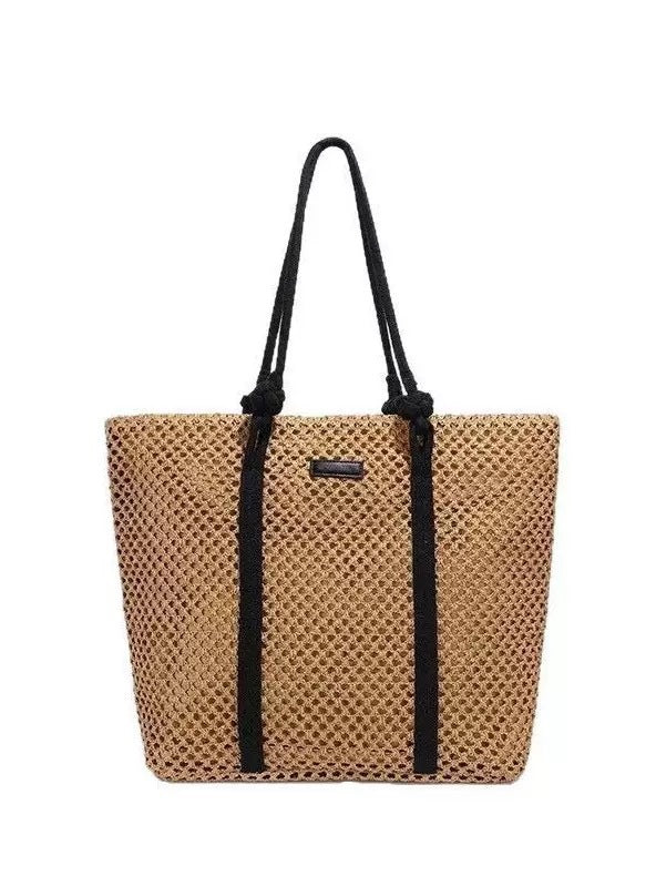 Beach bag made of hand-woven natural material with sturdy handles Bowlift