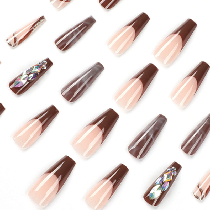 Artificial nail extensions with elegant gemstone embellishments Bowlift