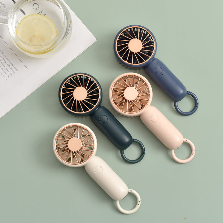 Cooling compact rechargeable handheld fan with carabiner loop and whisper-silent motor Bowlift