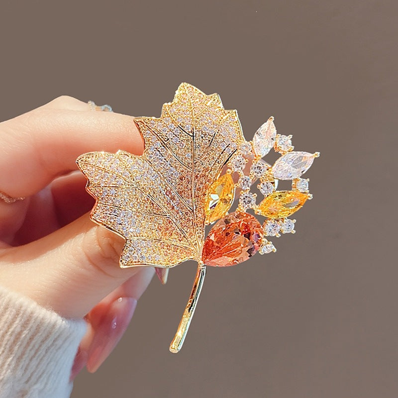 Exquisite leaf brooch with sparkling crystals Bowlift