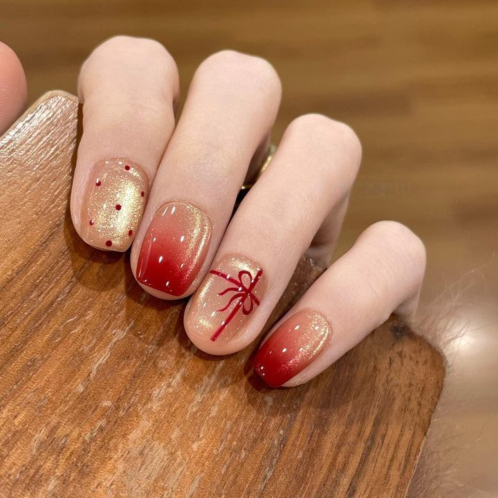 Artificial nails with festive gradient color and elegant decorations Bowlift