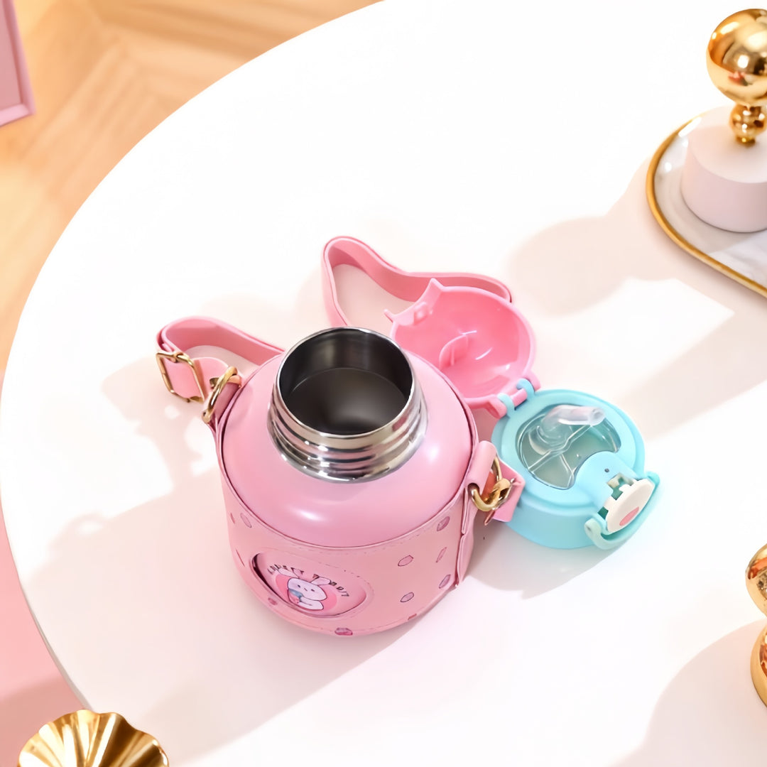 Insulated stainless steel drinking bottle with integrated carrying strap and practical lid Bowlift