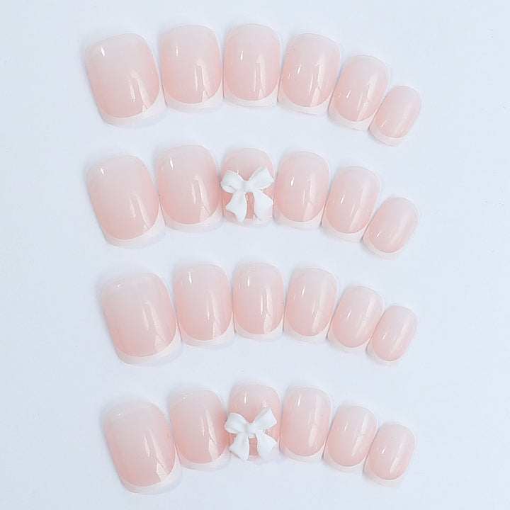 Nail set with elegant French tips and romantic floral decorations Bowlift
