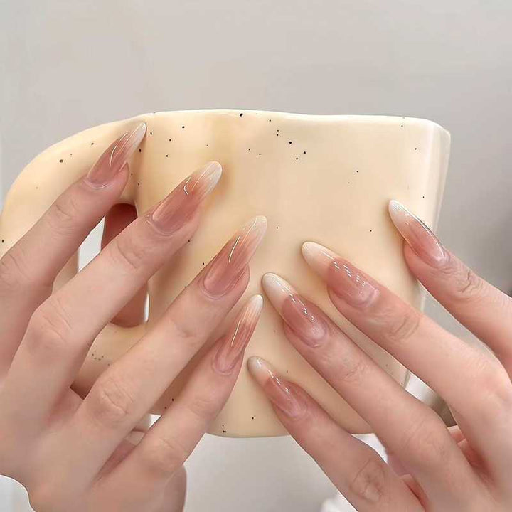 Artificial nails in the elegant French tip design Bowlift