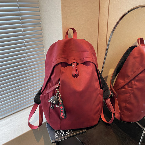 Fashionable backpack with practical design and decorative pendant Bowlift