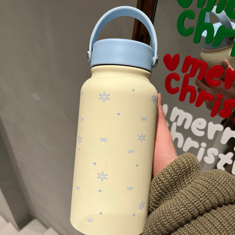Women's insulated drinking bottle with practical carrying handle and cheerful design Bowlift