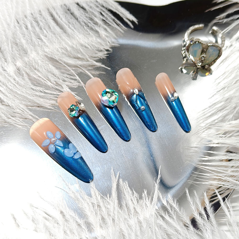 Artificial nails in elegant design with artistic decorations and glitter accents Bowlift
