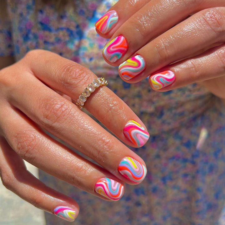 Acrylic nail set with colorful marble design and vibrant colors Bowlift