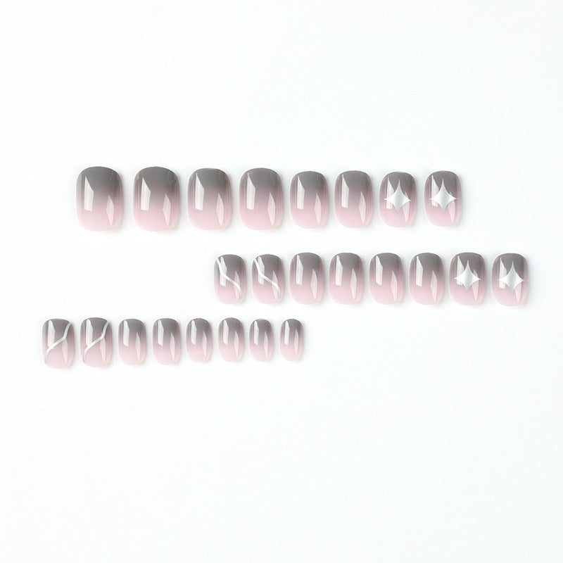 Artificial nail art with elegant ombre design and charming accents Bowlift
