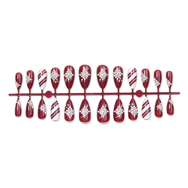 Acrylic Nail Set with Festive Winter Design and Glamorous Accents Bowlift