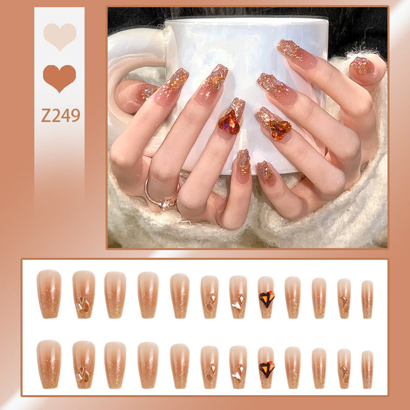 Artificial nail set with glitter and heart accents Bowlift