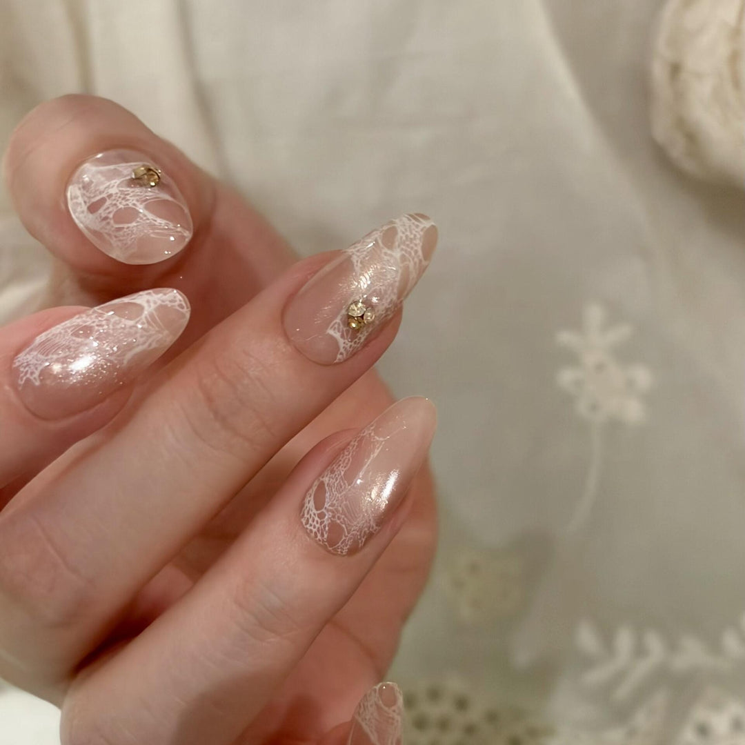 Elegant artificial nails with tips and glitter Bowlift