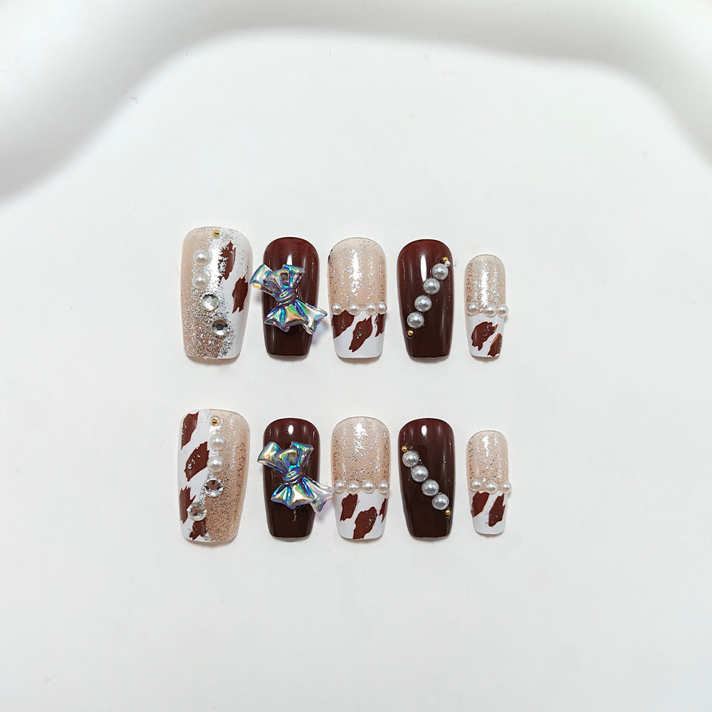 Artificial nails with glamorous rhinestone and bow design Bowlift