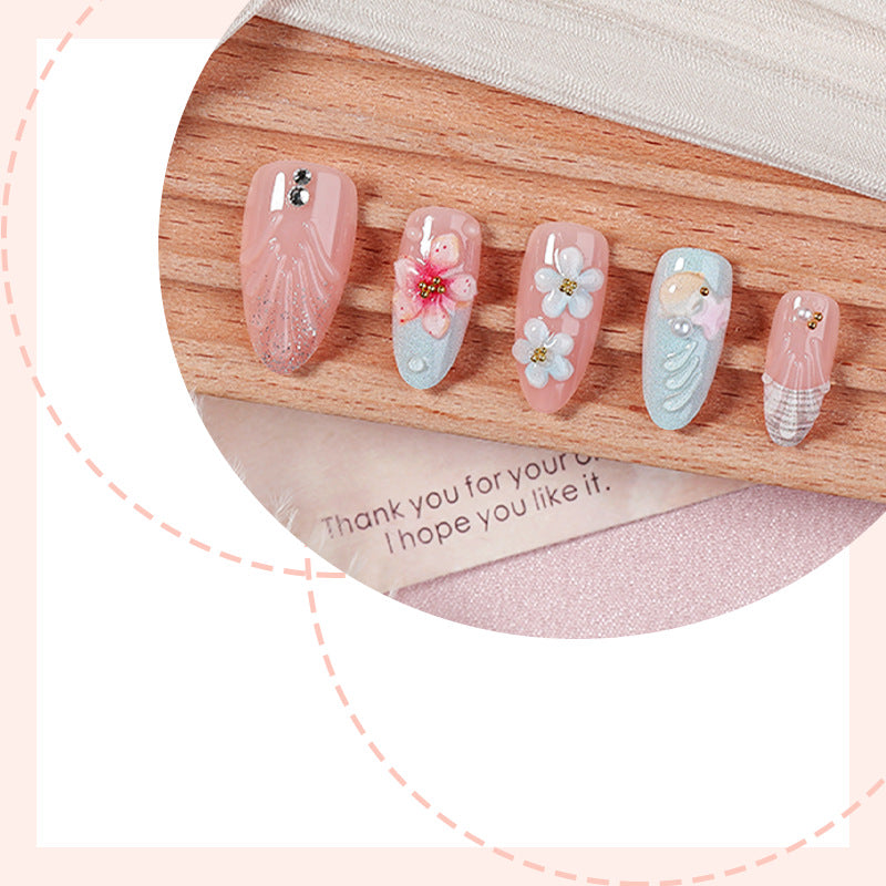 Artificial nail set with maritime motifs and colorful flowers Bowlift