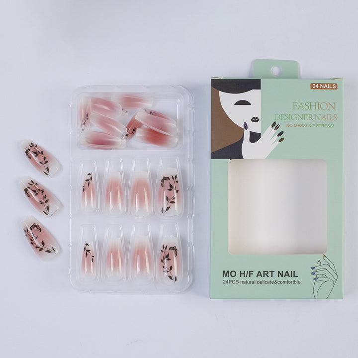 Press-on nails in elegant ombre design with floral accents Bowlift