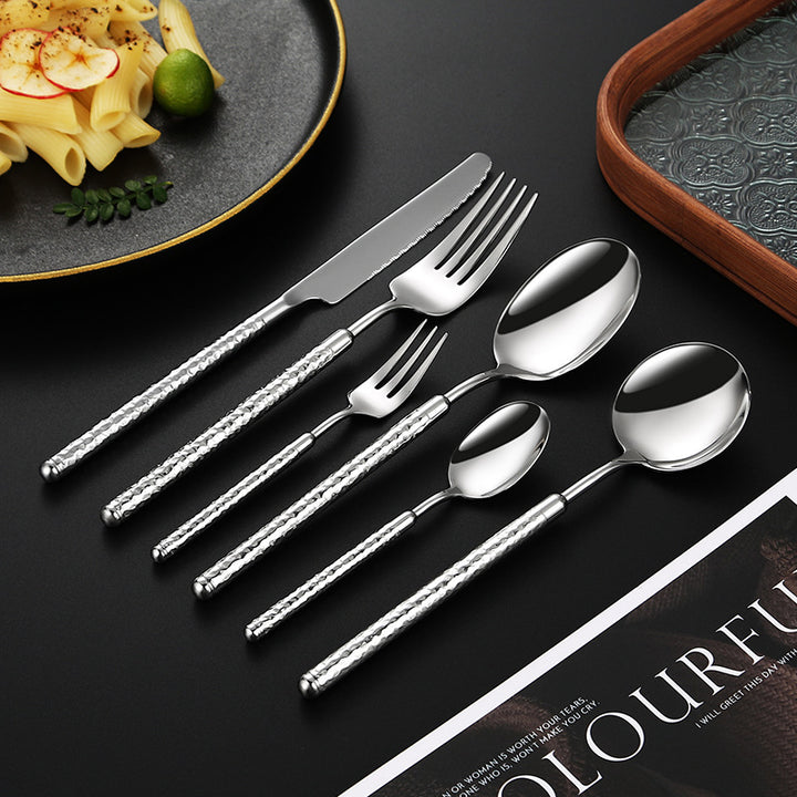 Elegant dessert spoon with elaborate handle design Bowlift