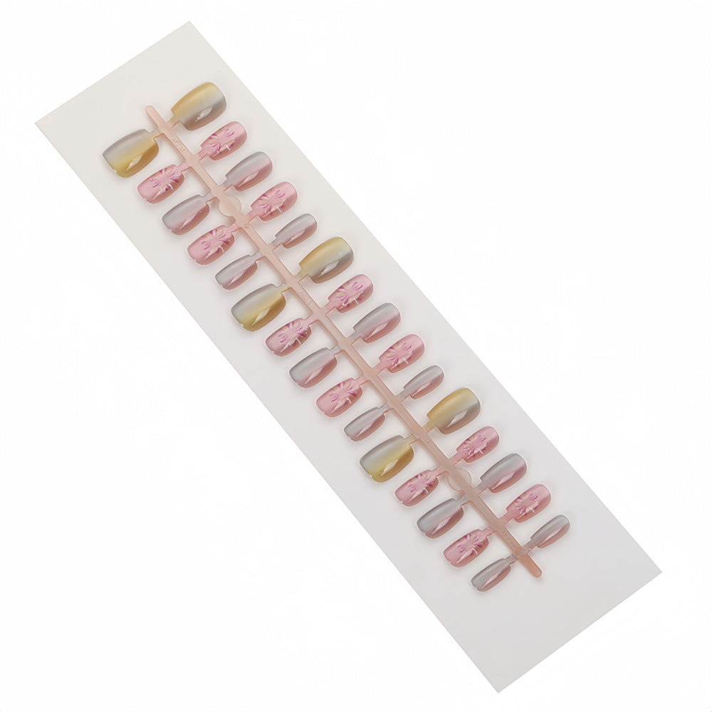 Artificial nails in modern ombre design with floral accents Bowlift