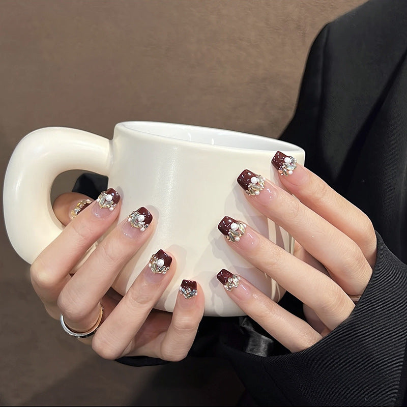 Acrylic nail set with elegant glitter and flower accents Bowlift