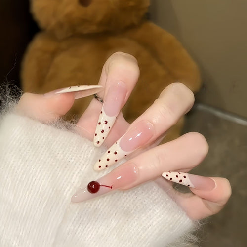Artificial nails with playful design and cherry accents Bowlift