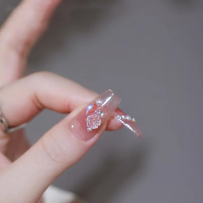 Artificial nails with heart design and glitter accents Bowlift