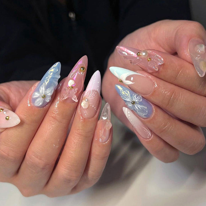 Artistic stiletto nails with delicate flower and glitter embellishments Bowlift