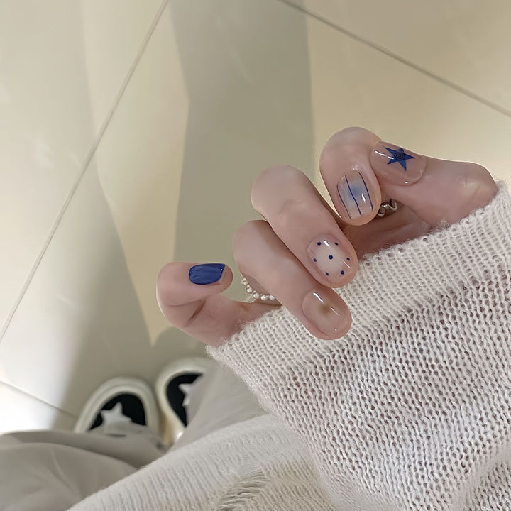 Artificial nails in modern design with geometric and sparkling accents Bowlift