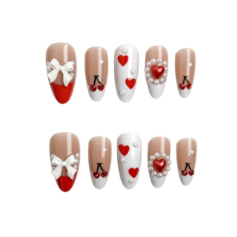 Creative nail art with heart and cherry motifs Bowlift