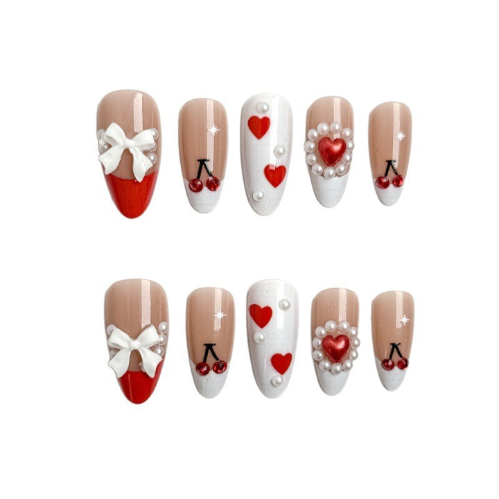 Creative nail art with heart and cherry motifs Bowlift