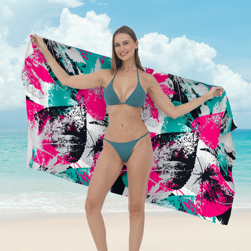 Beach towel with vibrant tropical plant motif Bowlift