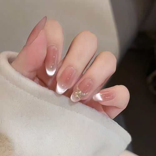 Artificial nails with elegant tip design and gold accents Bowlift